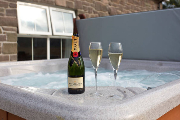 Celebrate spring with champagne in the hot tub at Oakside cottage